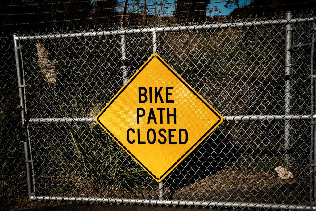 Bike Path Closed yellow sign on gate