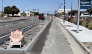 photo of San Pablo Ave protected bikeway curbs under construction near Del Norte BART in El Cerrito