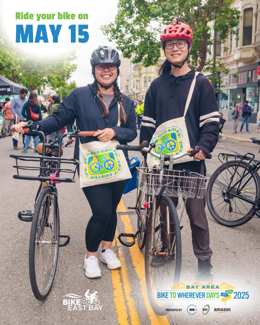 Bike to Wherever Day. 2 smiling bikers show off their bikes and tote bags in the streets of Old Oakland.